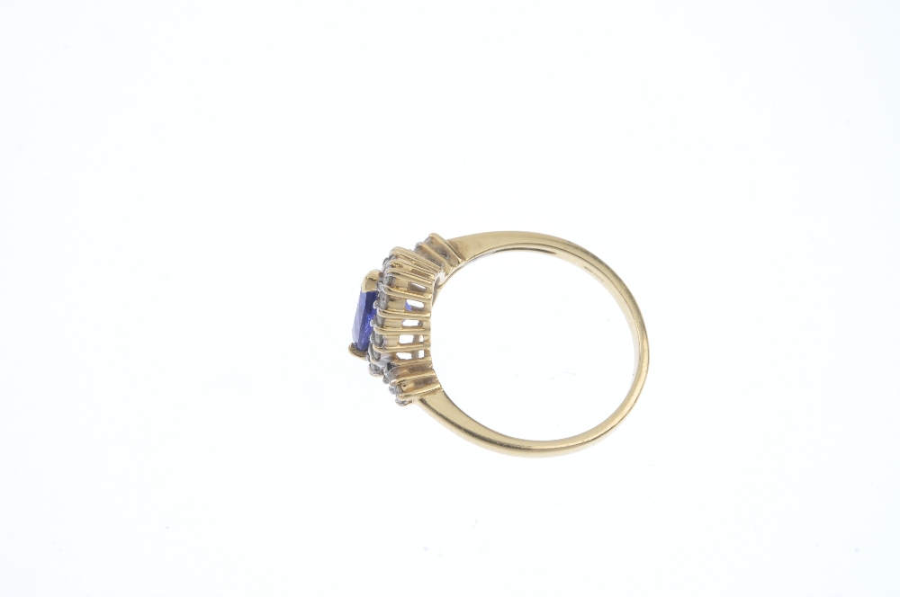 A coated tanzanite and diamond cluster ring. The pear-shape coated tanzanite, within a brilliant-cut - Image 3 of 4