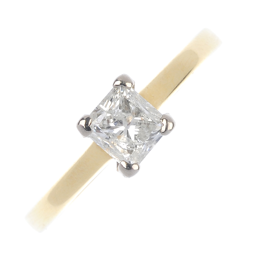 An 18ct gold diamond single-stone ring. The square-shape diamond, to the plain band. Estimated