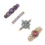 A selection of four 9ct gold gem-set rings. To include an amethyst five-stone ring, a garnet