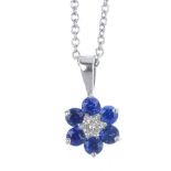 An 18ct gold sapphire and diamond cluster pendant. The brilliant-cut diamond, within a circular-