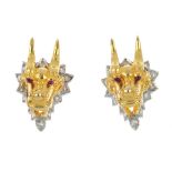 A pair of diamond dragon earrings. Each designed as a dragon head, with brilliant-cut diamond