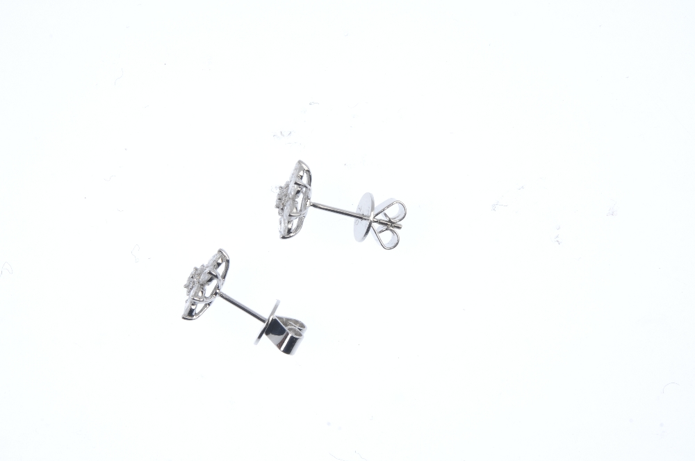 * A pair of diamond floral cluster ear studs. Each designed as a brilliant-cut diamond cluster, - Image 3 of 4