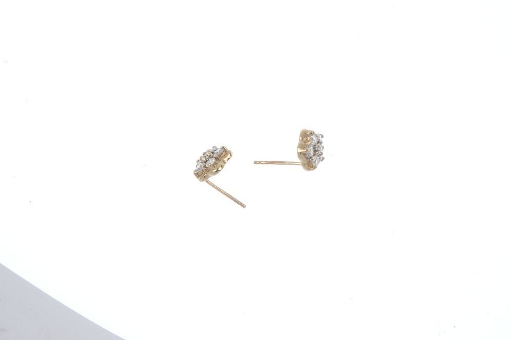 A pair of 9ct gold diamond cluster ear studs. Each designed as a brilliant-cut diamond, within a - Image 3 of 3