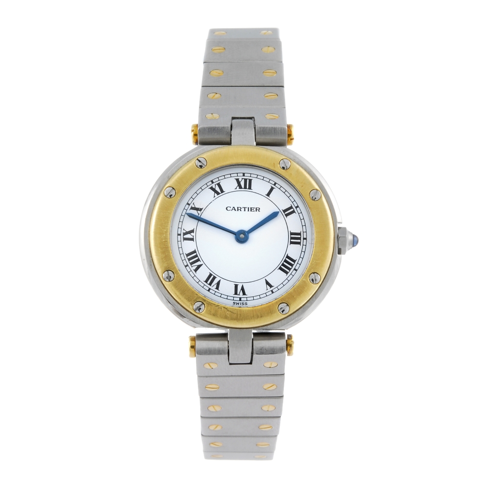 CARTIER - a Santos bracelet watch. Stainless steel case with yellow metal bezel. Numbered