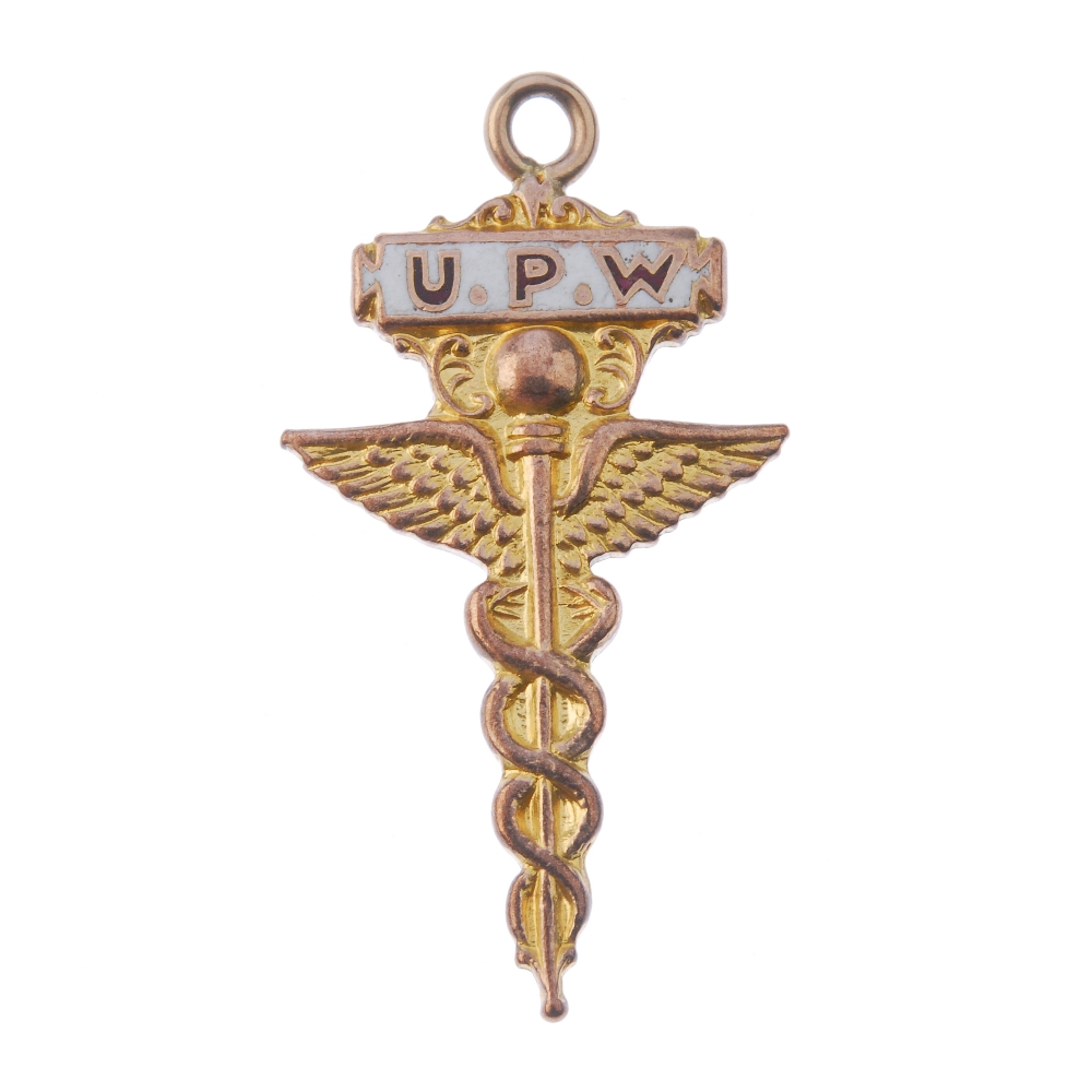 A 1920's 9ct gold U.P.W fob medal, the winged sword with enamelled plaque and personal inscription