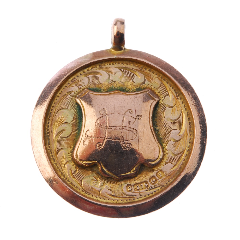 A 1930's 9ct gold and enamel fob medal, the circular form with monogrammed shield cartouche and