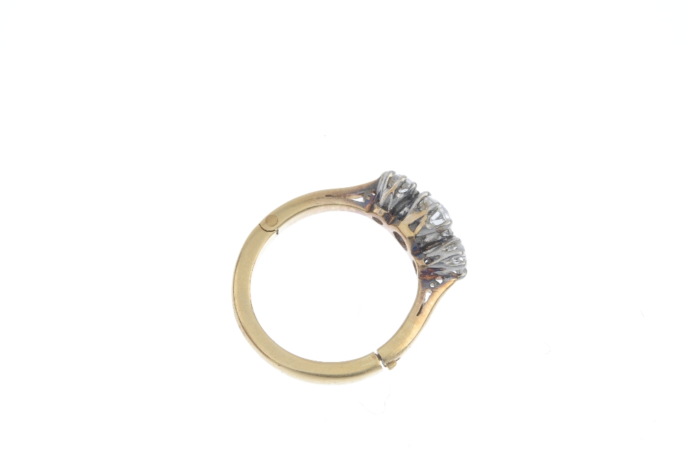 A mid 20th century diamond three-stone ring. The graduated old-cut diamond line, to the tapered - Image 8 of 10