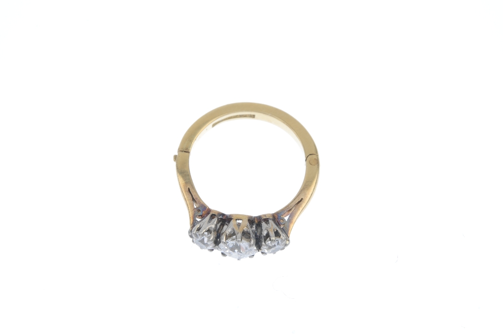 A mid 20th century diamond three-stone ring. The graduated old-cut diamond line, to the tapered - Image 4 of 10