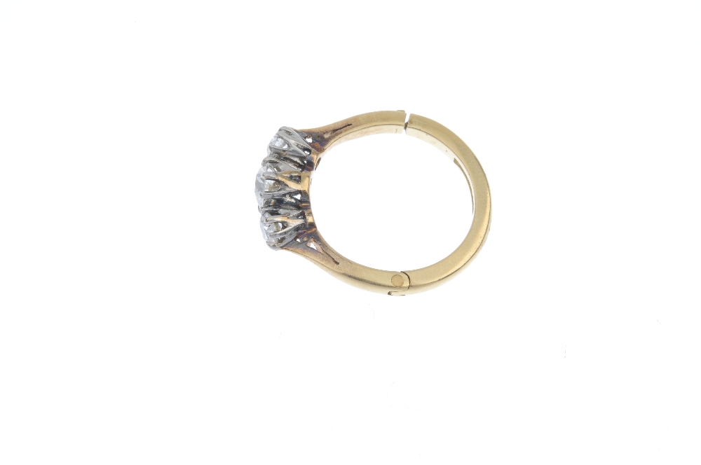 A mid 20th century diamond three-stone ring. The graduated old-cut diamond line, to the tapered - Image 6 of 10