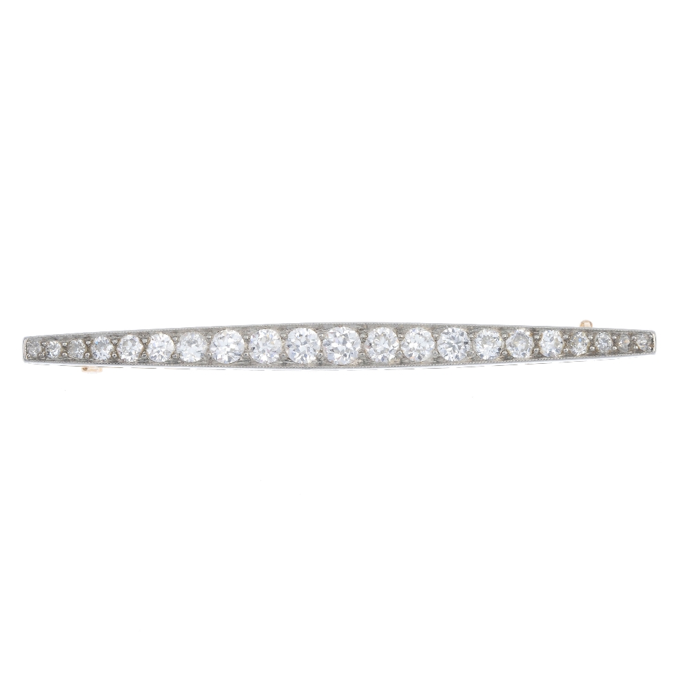 An early 20th century gold and platinum diamond bar brooch. Designed as a graduated circular-cut - Image 2 of 4