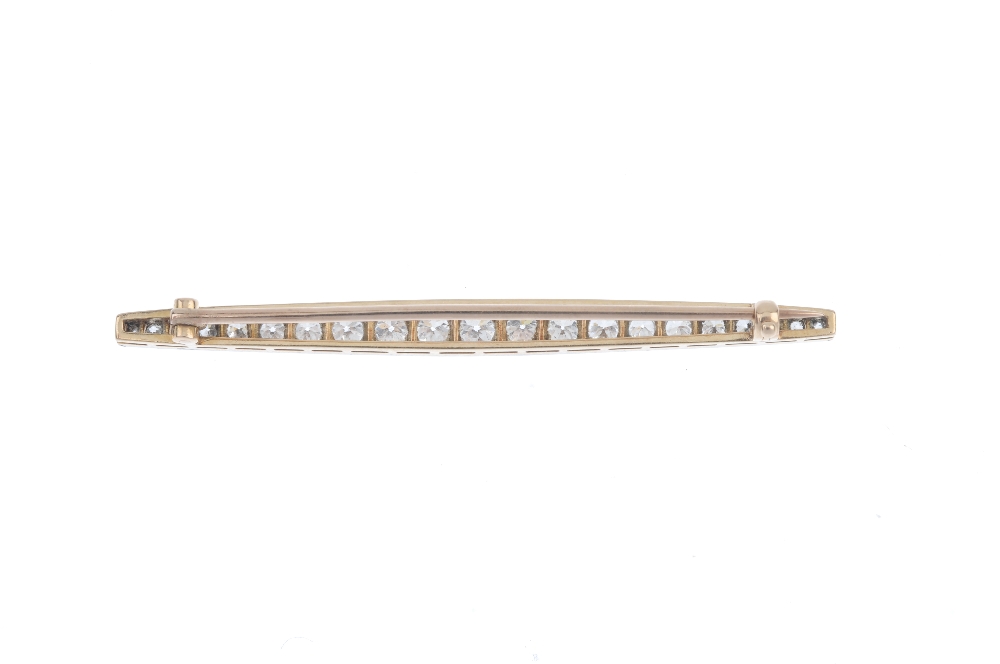 An early 20th century gold and platinum diamond bar brooch. Designed as a graduated circular-cut - Image 4 of 4