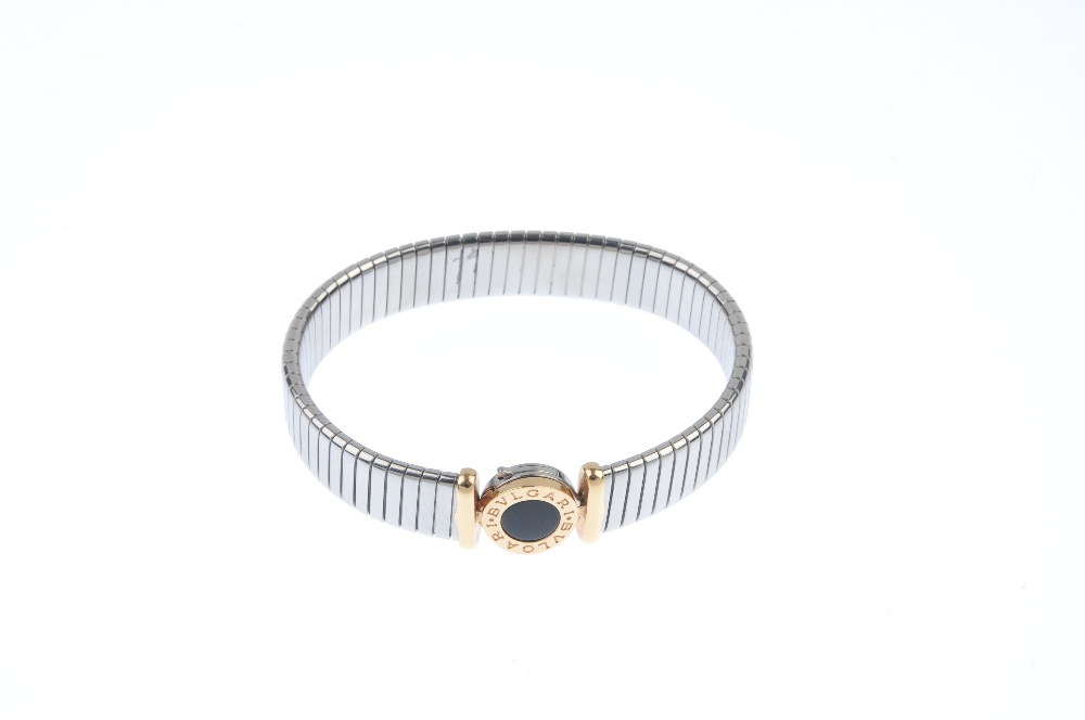 BULGARI - a steel and gold bracelet. Of bi-colour design, the flexible bracelet, to the circular - Image 3 of 6