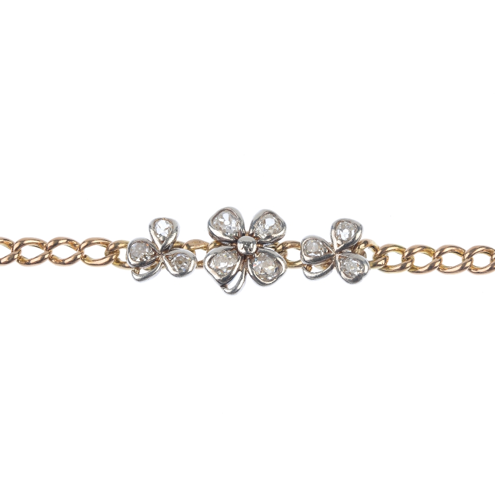 An early 20th century gold diamond clover bracelet. Designed as an old-cut diamond four-leaf clover,