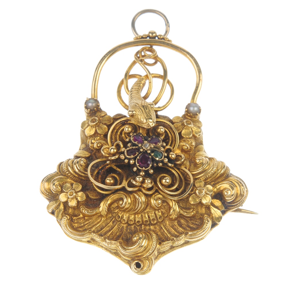 An early 19th century gold 'regard' snake locket. Of padlock design, the ruby, emerald, garnet and