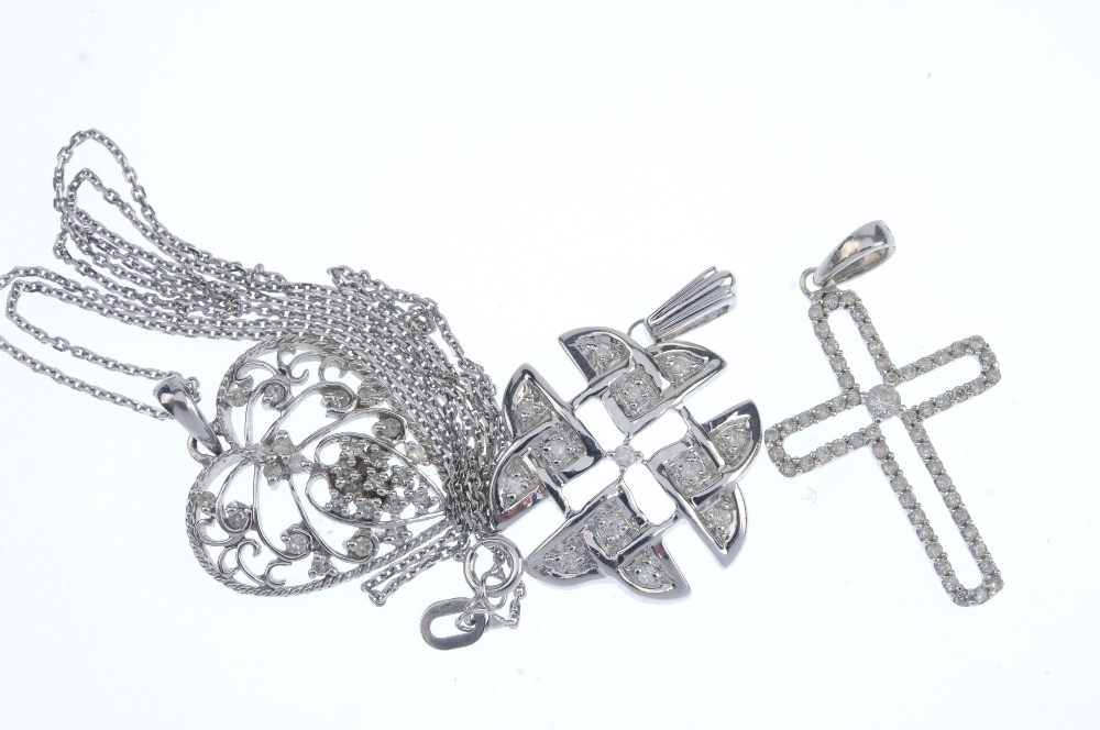 A selection of three 9ct gold diamond pendants. To include a diamond cross pendant, a diamond - Image 2 of 2