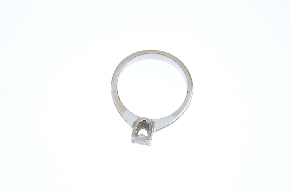 A diamond single-stone ring. The brilliant-cut diamond, to the tapered shoulders and plain band. - Image 2 of 4