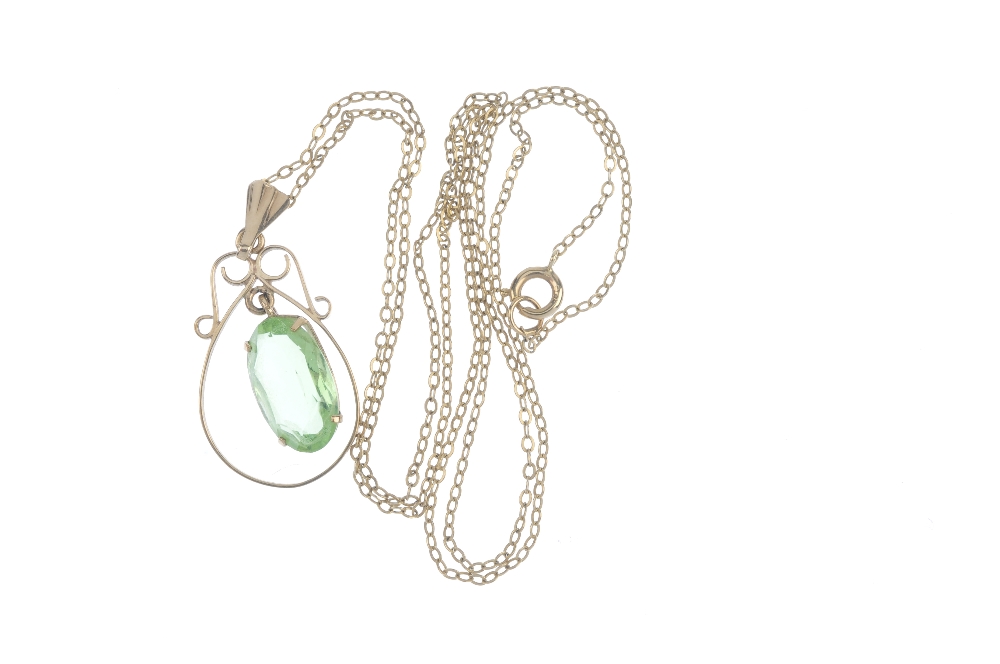 A 9ct gold paste single-stone pendant. The oval-shape green paste drop, suspended within a scroll - Image 2 of 2