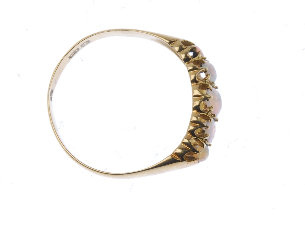 An Edwardian 18ct gold opal five-stone ring. The oval-shape opal cabochon graduated line, to the - Image 2 of 2