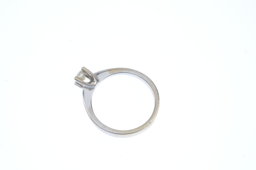 A diamond single-stone ring. The brilliant-cut diamond, to the tapered shoulders and plain band. - Image 3 of 4
