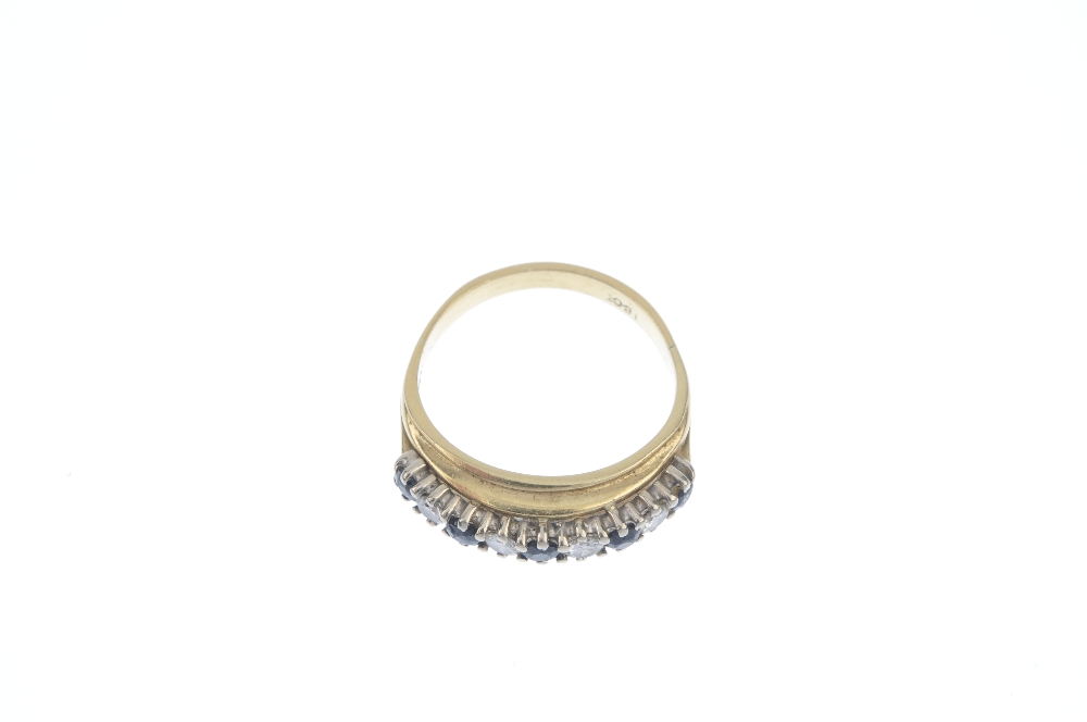 A sapphire and diamond half-circle eternity ring. The alternating circular-shape sapphire and - Image 2 of 3