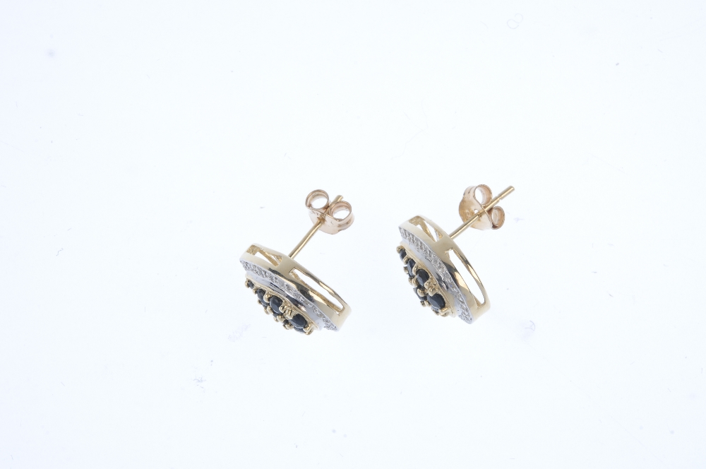 A pair of 9ct gold sapphire and diamond cluster ear studs. Each of pear-shape outline, the - Image 2 of 2