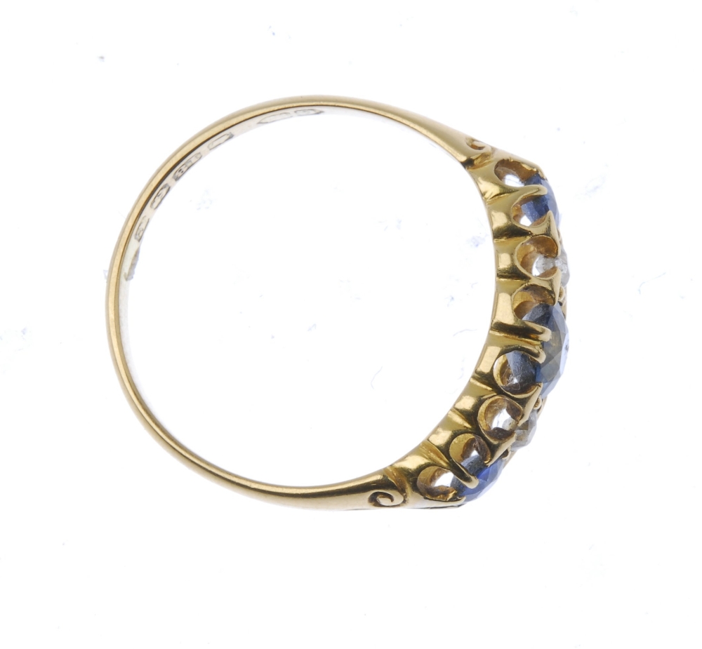 An Edwardian 18ct gold sapphire and diamond ring. The circular-shape sapphire and brilliant-cut - Image 2 of 3