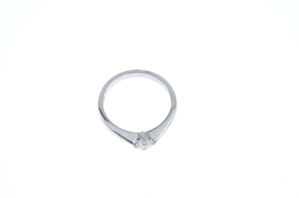 A platinum diamond single-stone ring. The brilliant-cut diamond, to the tapered shoulders and - Image 2 of 3