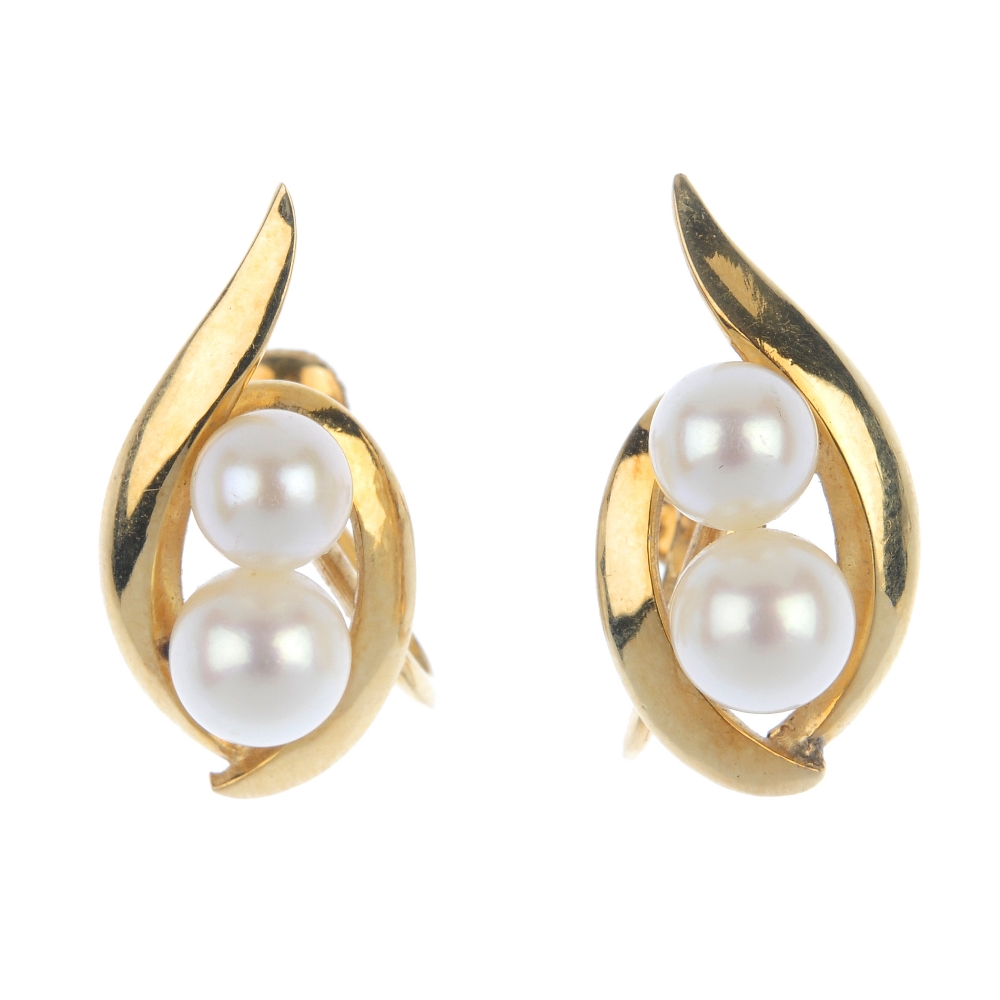 MIKIMOTO - a pair of cultured pearl ear clips. Each designed as two graduated pearls, measuring 6.