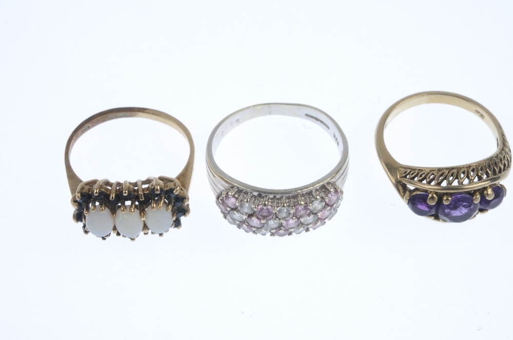 A selection of three gem-set dress rings. To include an amethyst three-stone ring, a 9ct gold oval - Image 2 of 3