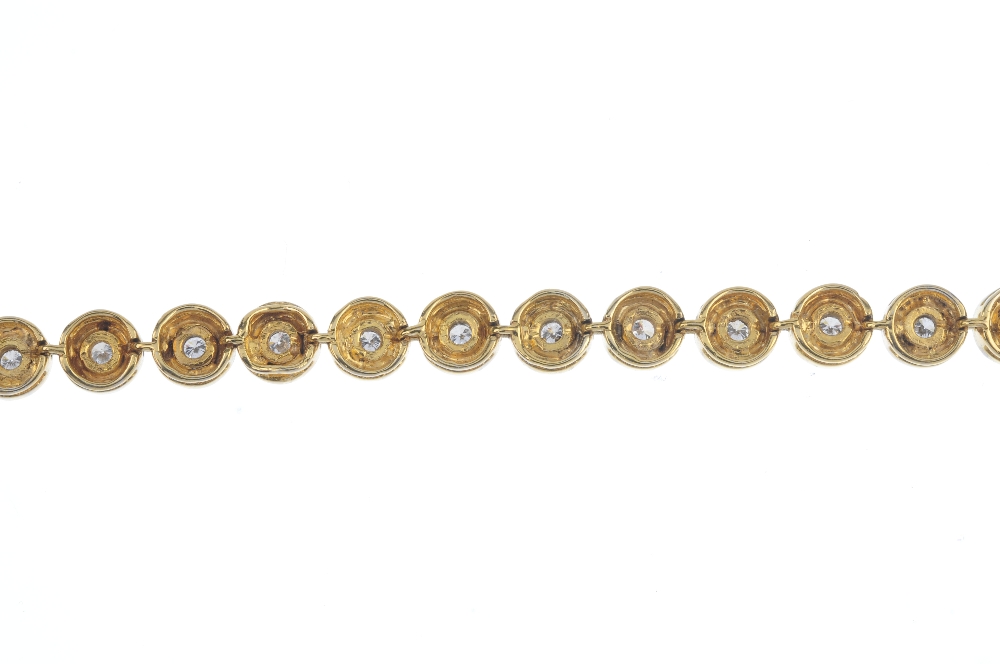 A 9ct gold diamond line bracelet. Designed as a series of brilliant-cut diamond, wide collet - Image 2 of 3