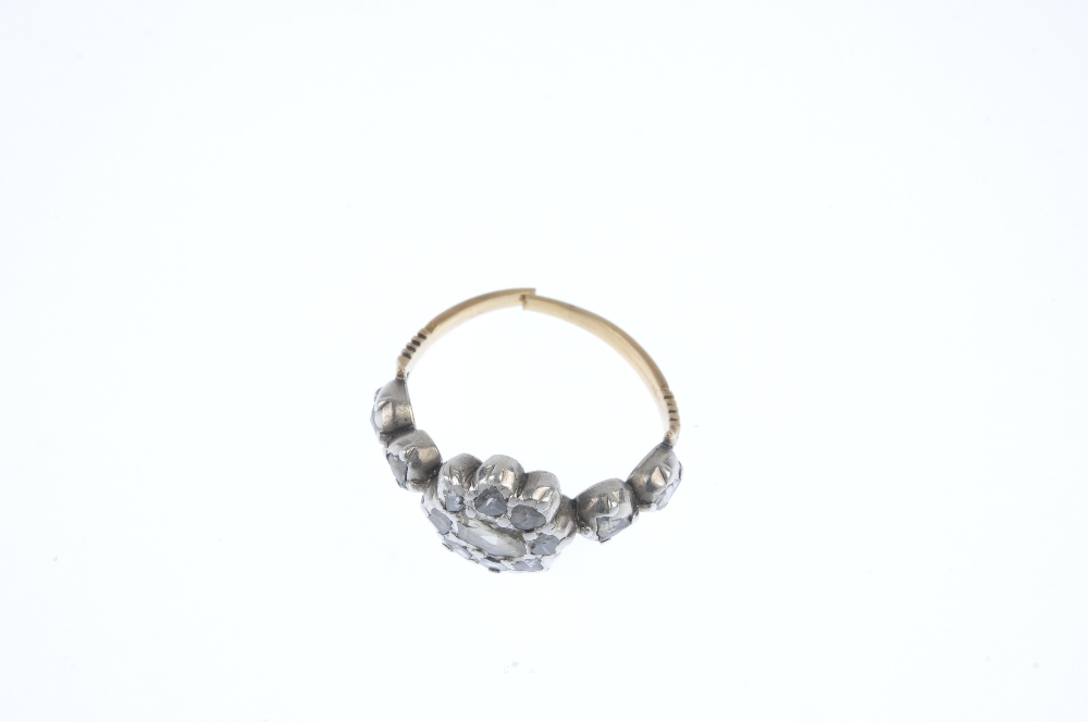 An early 19th century silver and gold, diamond ring. The rose-cut diamond scalloped cluster, to - Image 2 of 3