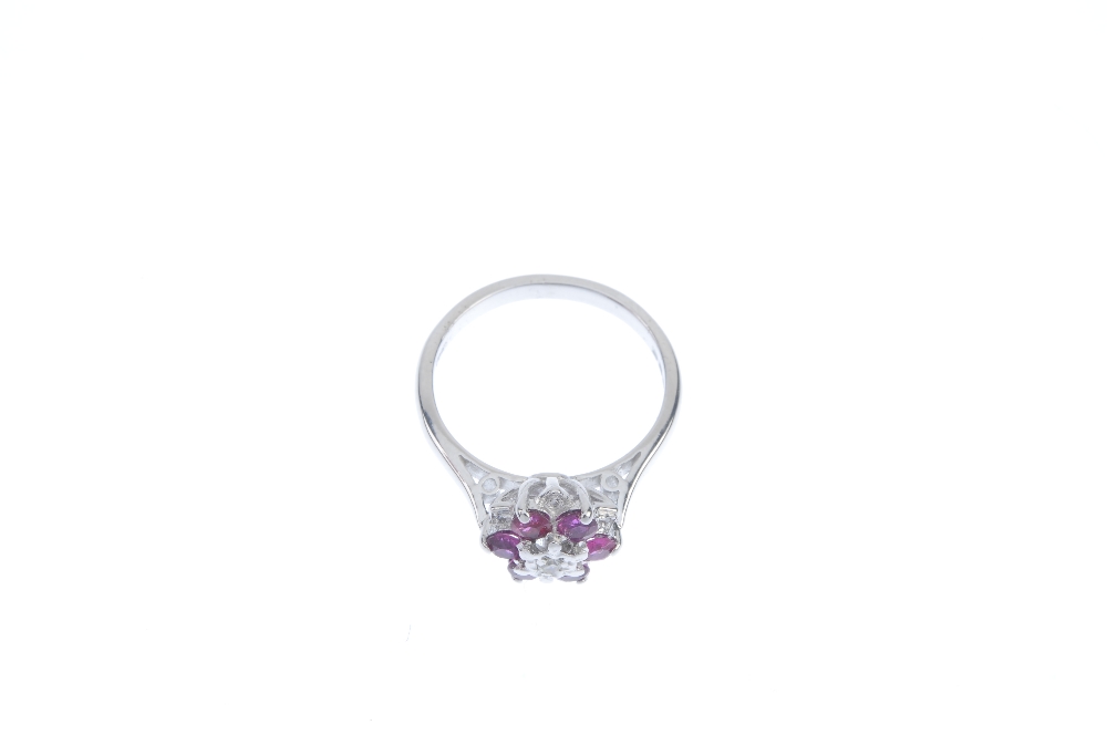An 18ct gold ruby and diamond floral cluster ring. The single-cut diamond, within a circular-shape - Image 2 of 3