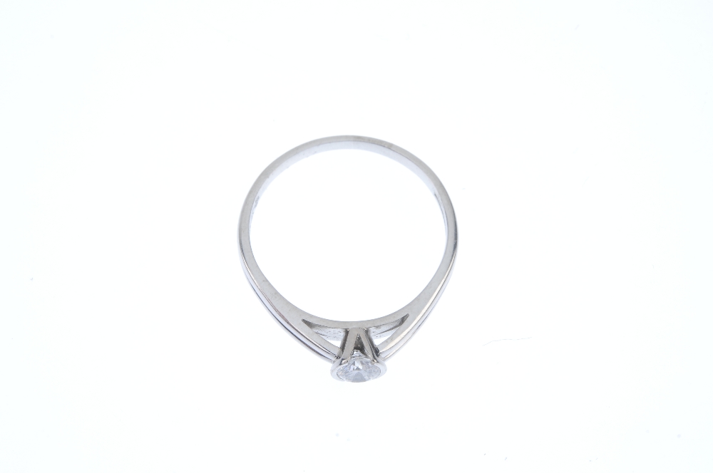 An 18ct gold diamond single-stone ring. The brilliant-cut diamond, within a partial collet mount, to - Image 2 of 3