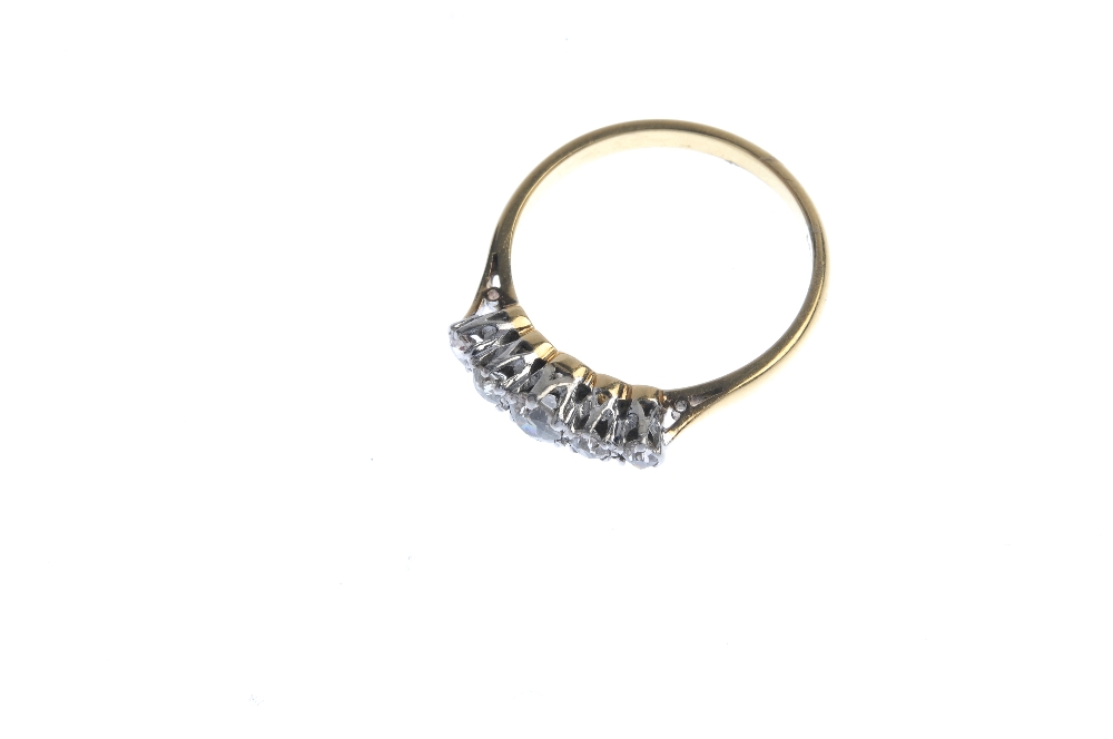 A mid 20th century 18ct gold diamond five-stone ring. The graduated old-cut diamond line, to the - Image 2 of 4