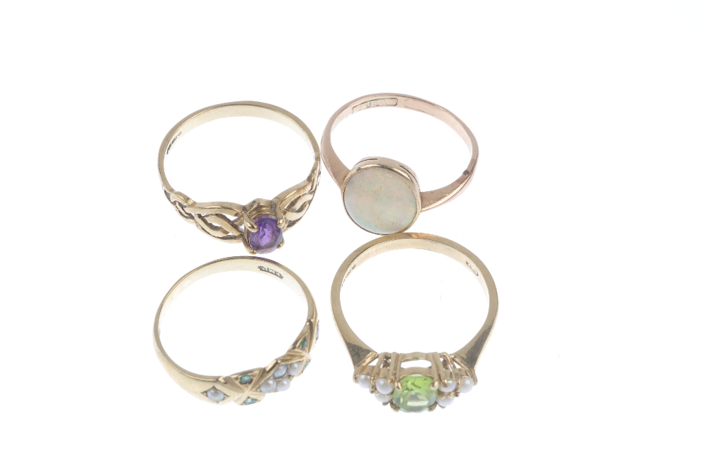 A selection of four 9ct gold gem-set rings. To include an early 20th century oval opal cabochon - Image 2 of 3