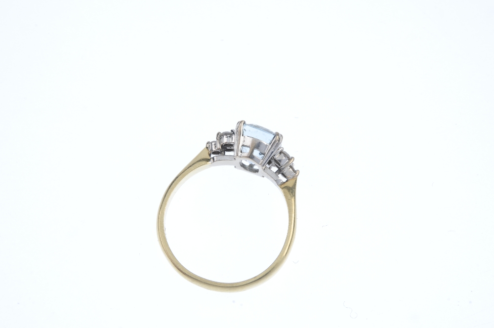 An 18ct gold aquamarine and diamond dress ring. The cushion-shape aquamarine, with brilliant-cut - Image 3 of 3