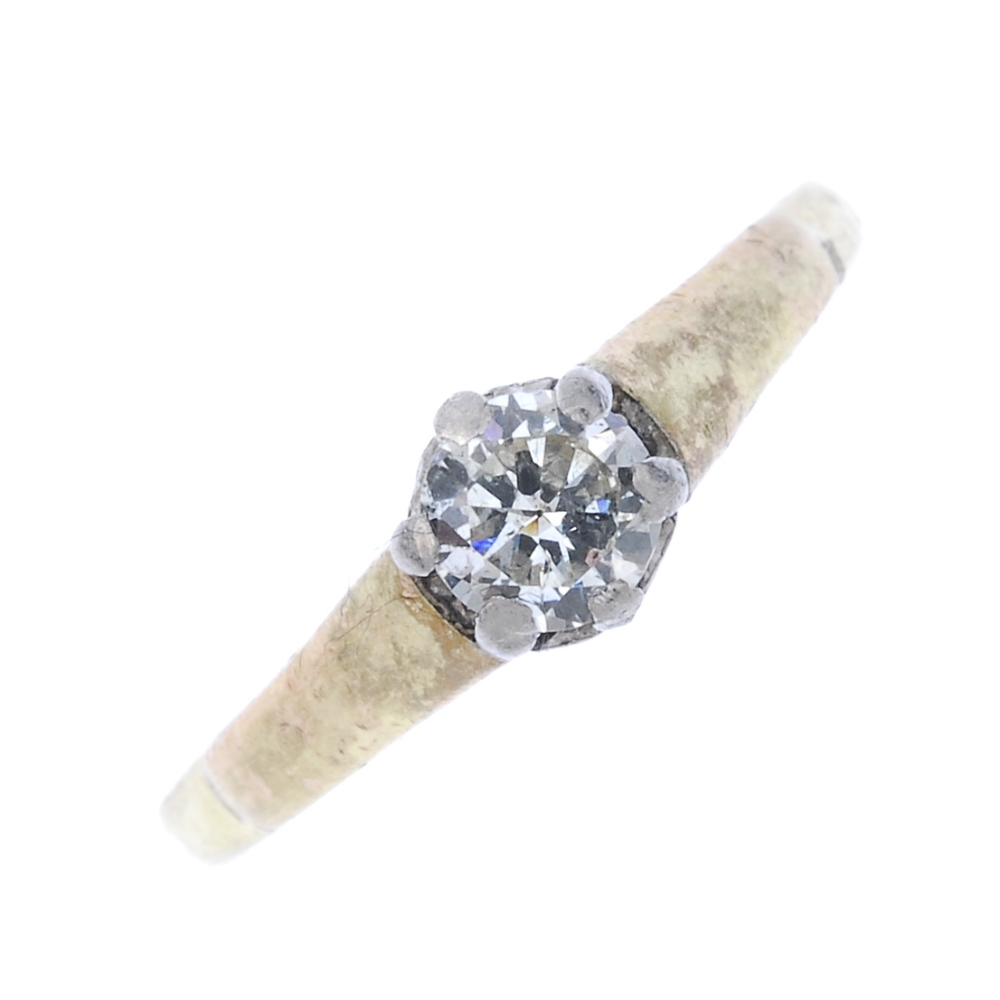 A diamond single-stone ring. The brilliant-cut diamond, to the tapered band. Estimated diamond