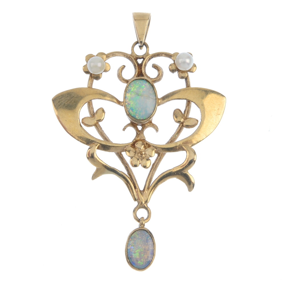 A 9ct gold opal and pearl pendant. Of openwork design, the oval opal cabochon collet, within a