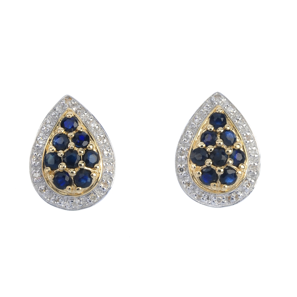 A pair of 9ct gold sapphire and diamond cluster ear studs. Each of pear-shape outline, the