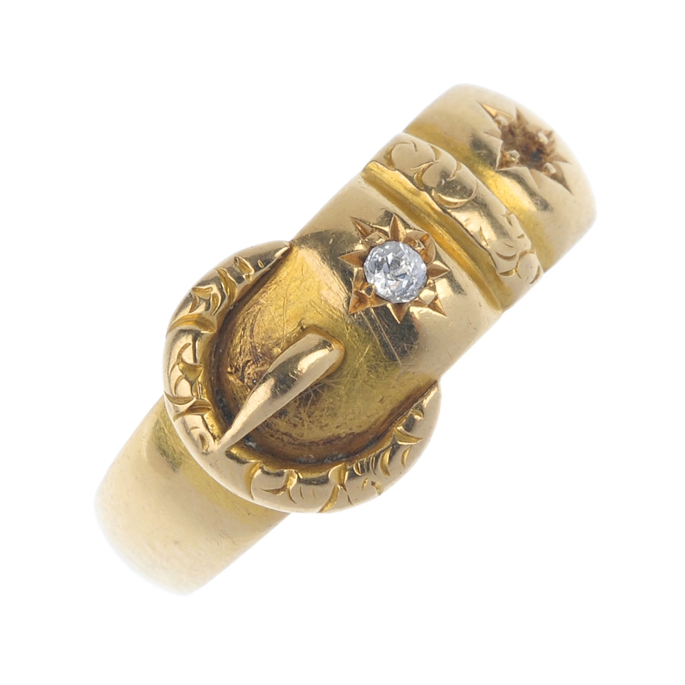 A late Victorian 18ct gold buckle ring. The textured buckle with old-cut diamond accents. One