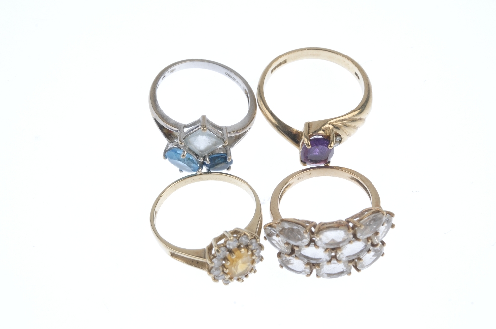 A selection of four 9ct gold gem-set rings. To include a vari-shade blue topaz dress ring, a citrine - Image 2 of 3