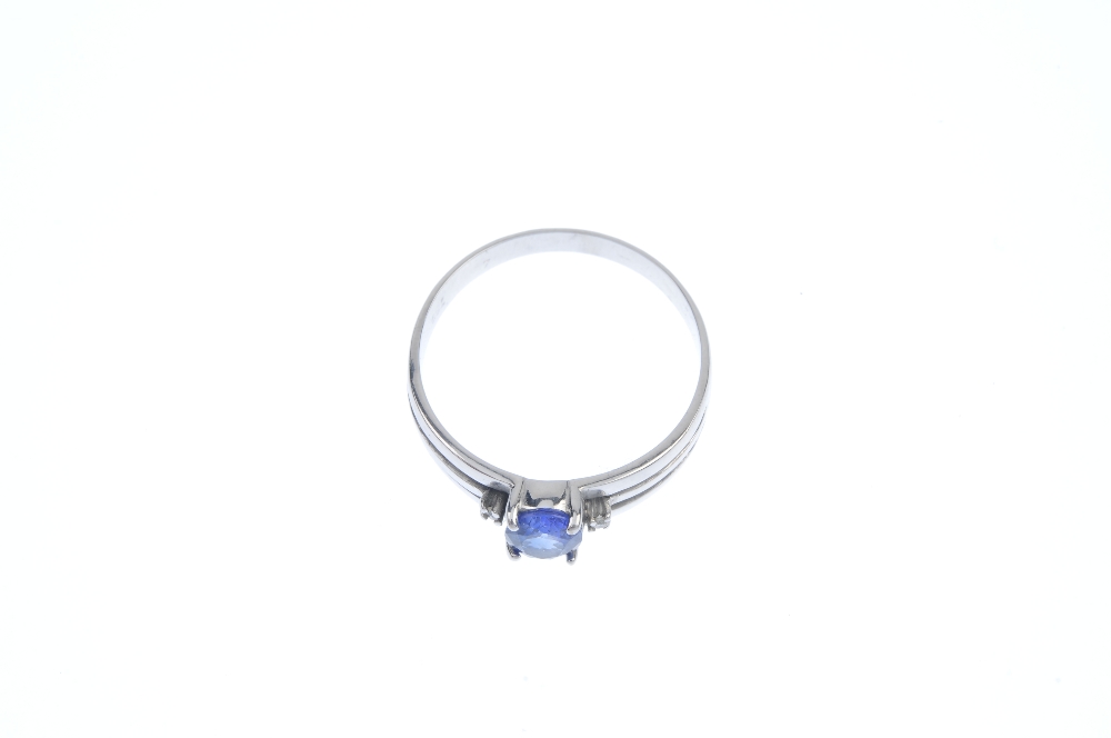 A sapphire and diamond three-stone ring. The oval-shape sapphire, with brilliant-cut diamond - Image 2 of 4