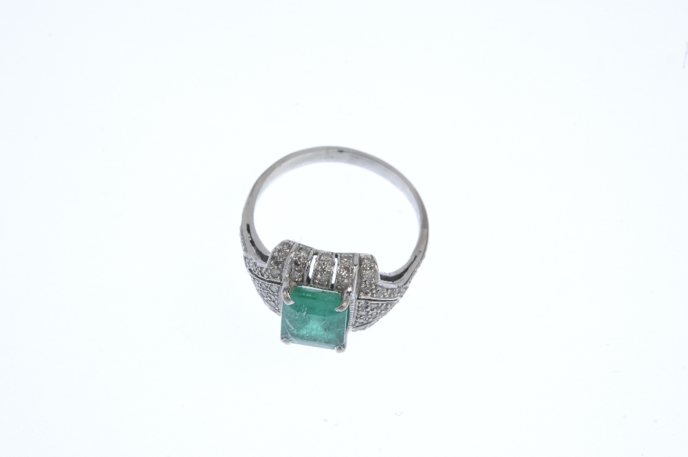 An emerald and diamond dress ring. The rectangular-shape emerald, within a pave-set diamond - Image 2 of 3