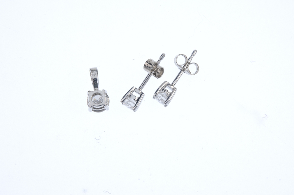A diamond single-stone pendant and ear studs. To include a 9ct gold brilliant-cut diamond single- - Image 2 of 2