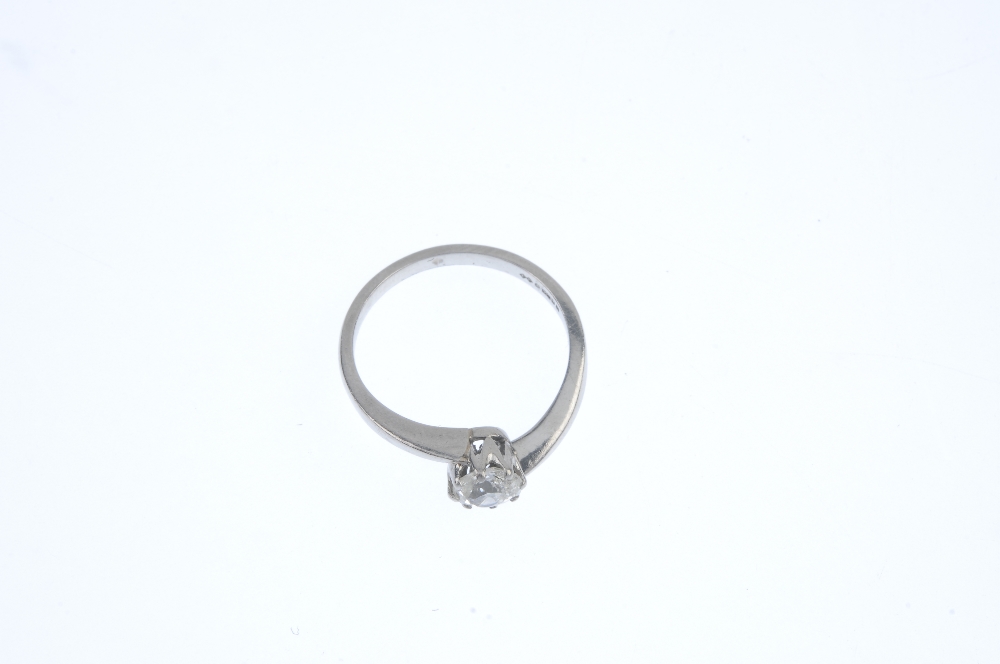 A platinum diamond single-stone ring. The old-cut diamond, to the asymmetric shoulders and plain - Image 2 of 3