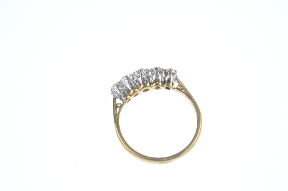 A mid 20th century 18ct gold diamond five-stone ring. The graduated old-cut diamond line, to the - Image 4 of 4