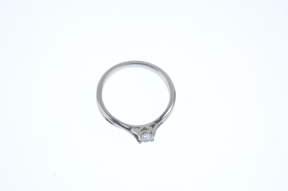 A platinum diamond single-stone ring. The brilliant-cut diamond, to the crossover shoulders and - Image 2 of 3