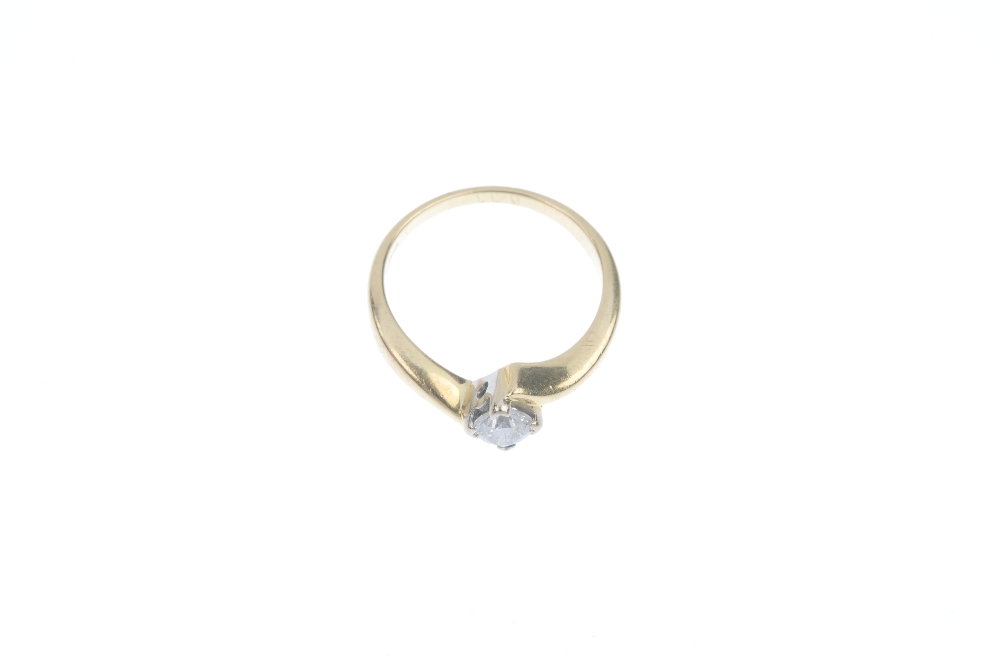 An 18ct gold diamond single-stone ring. The brilliant-cut diamond, to the asymmetric shoulders. - Image 2 of 3