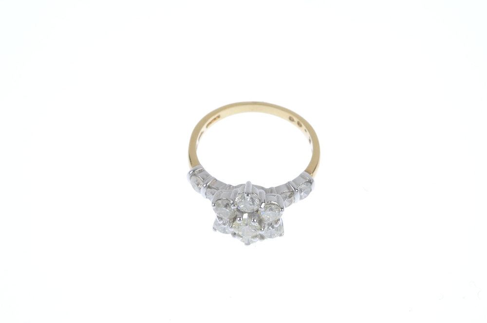 An 18ct gold diamond cluster ring. The brilliant-cut diamond floral cluster, to the similarly-cut - Image 2 of 3
