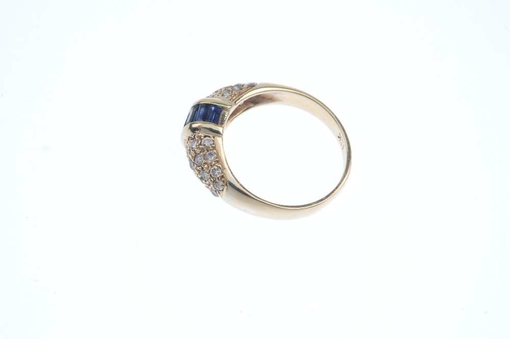 A sapphire and diamond dress ring. The rectangular-shape sapphire line, with bar sides, to the - Image 3 of 4